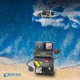 Blue Sea 285-Series 120A thermal circuit breaker with waterproof protection, displayed on a beach background with a boat using solar power in the ocean